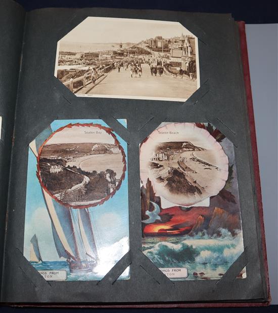 A 20th century postcard album, including comic, Ypres war damage, greetings, topographical and other examples (170 +)